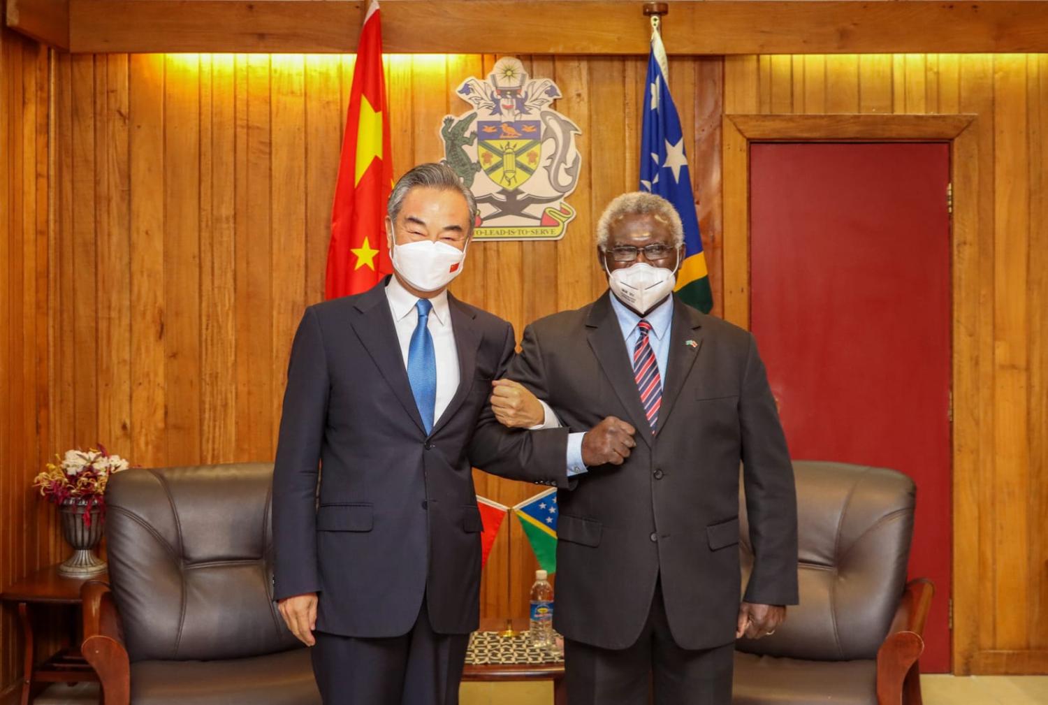 Solomon Islands Prime Minister Manasseh Sogavare (right) meets with China's Foreign Minister Wang Yi in Honiara, Solomon Islands, in May (Xinhua via Getty Images)