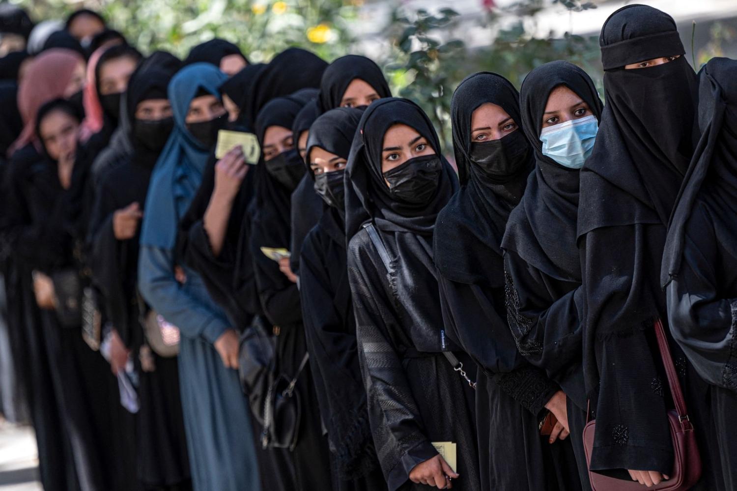 Afghan female students queue for entrance exams at Kabul University on 13 October 2022. One week later, the Taliban banned all women from university "until further notice" (Wakil Kohsar/AFP via Getty Images)