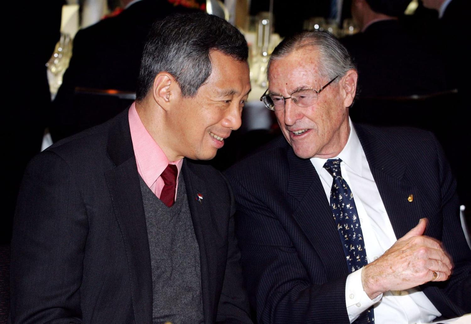 Richard Woolcott, right, alongside Singapore's Prime Minister Lee Hsien Loong in 2006, Sydney (Paul Miller via Getty Images)
