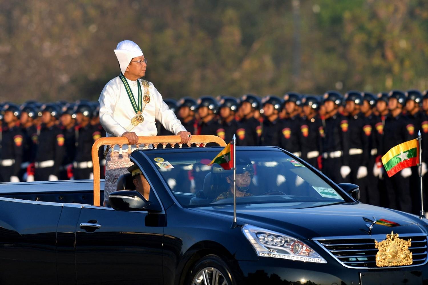 Myanmar’s military chief Min Aung Hlaing oversees a military display to mark the country’s Independence Day in Naypyidaw on 4 January 2023 (STR/AFP via Getty Images)