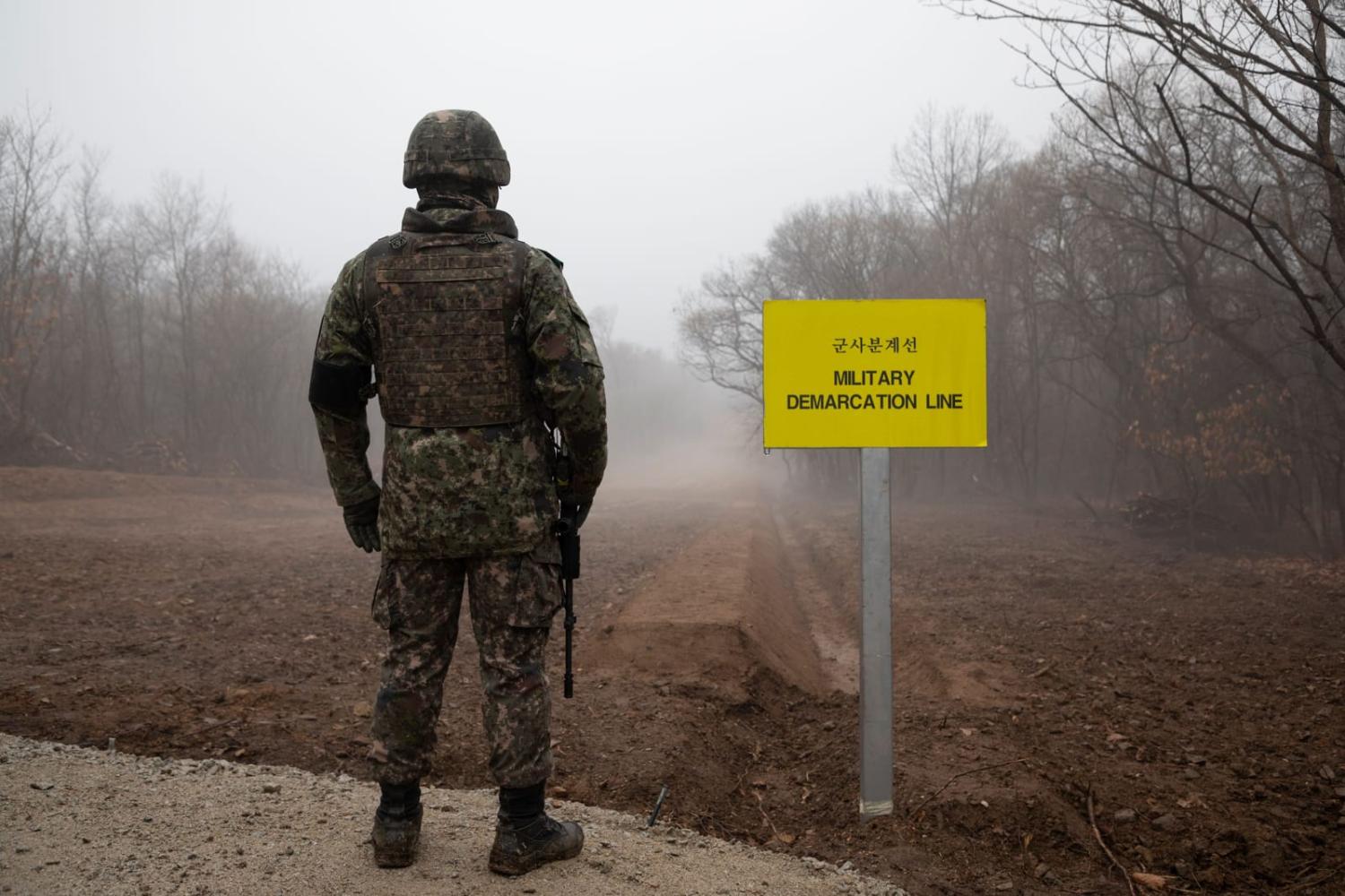 A South Korean soldier stands before the Military Demarcation Line (MDL) separating North and South Korea (Yelim Lee/AFP via Getty Images)
