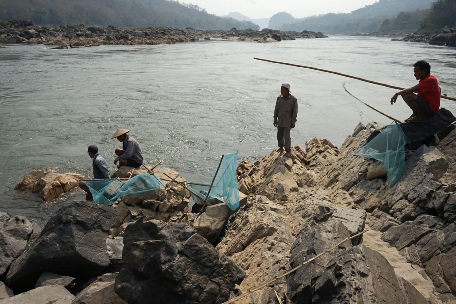 Fishermen laying their nets on the Mekong River in 2020 near Luang Prabang, close to the site of the new Laos dam (Aidan Jones/AFP via Getty Images)