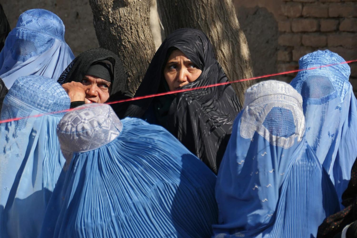 Women wait to receive food aid in Herat, 2 March (Mohsen Karimi/AFP via Getty Images)
