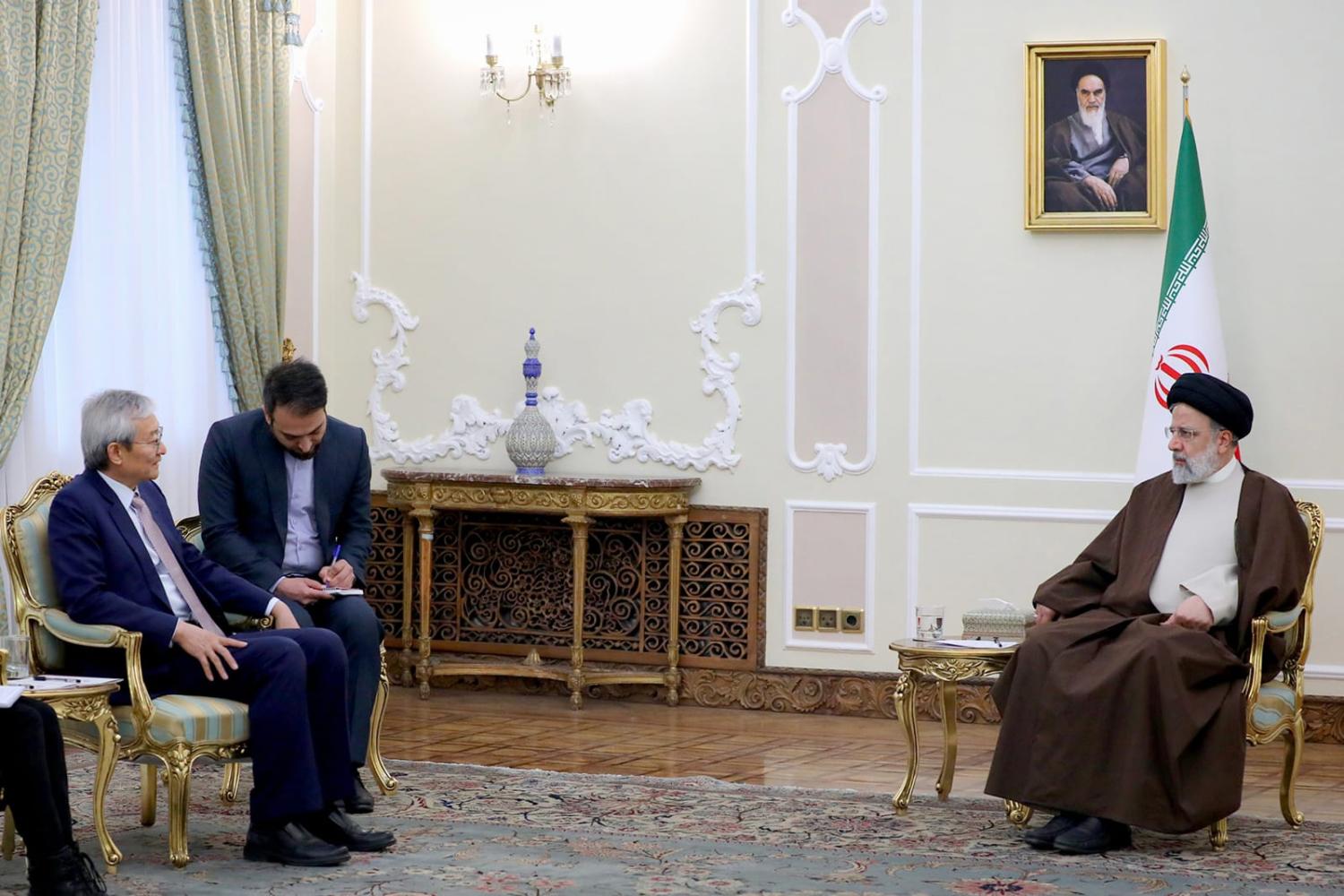 Iranian President Ebrahim Raisi (right) met Shanghai Cooperation Organisation Secretary-General Zhang Ming in Tehran in March (Iranian Presidency/Anadolu Agency via Getty Images)