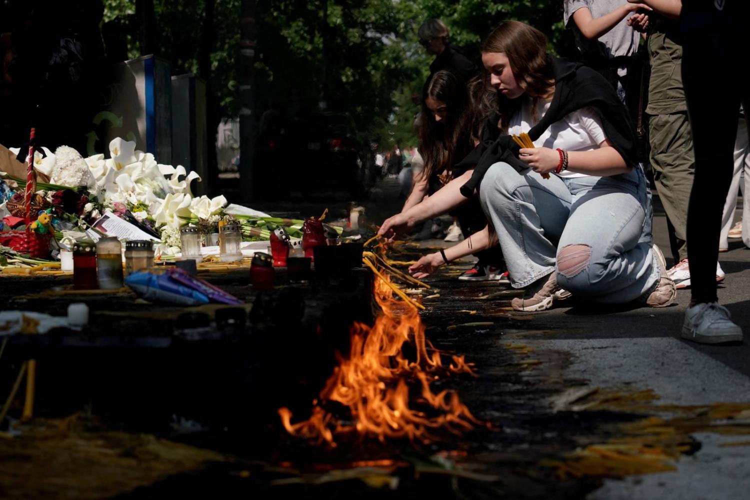 Flowers and candles for the victims outside the Vladislav Ribnikar elementary school in the Serbian capital Belgrade following a mass shooting last week (Oliver Bunic/AFP via Getty Images)