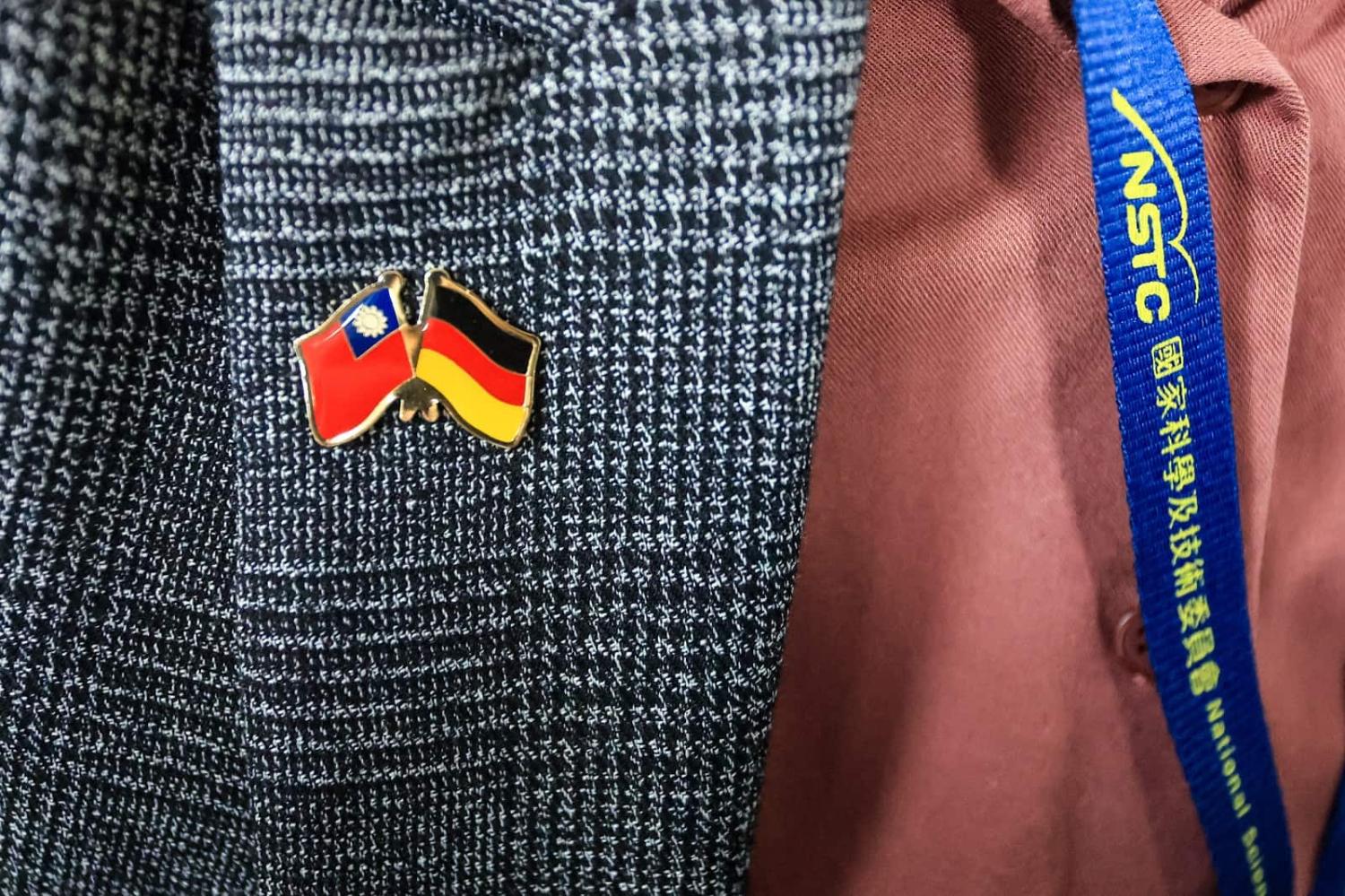 A diplomat wears a Taiwan-Germany pin during a German ministerial delegation visiting Taiwan to sign an agreement on semiconductors, Taipei, 21 March 2023 (Ceng Shou Yi/NurPhoto via Getty Images)