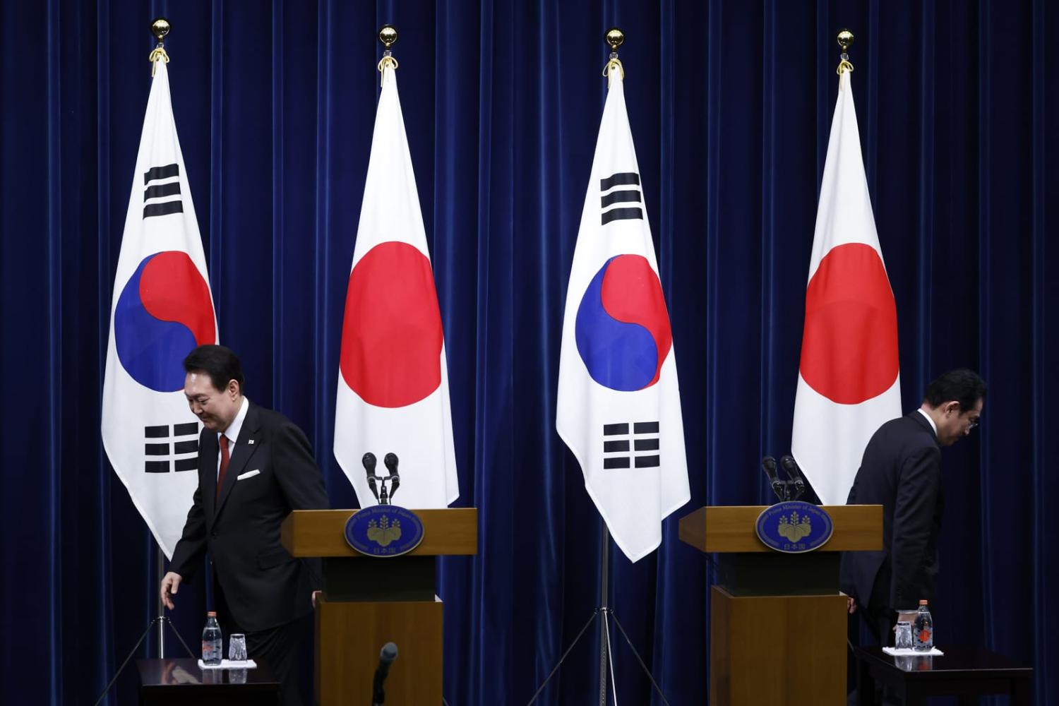 Yoon Suk-yeol, South Korea's president, left, and Fumio Kishida, Japan's prime minister, leave the stage after a joint news conference in Tokyo in March (Kiyoshi Ota/Bloomberg via Getty Images)