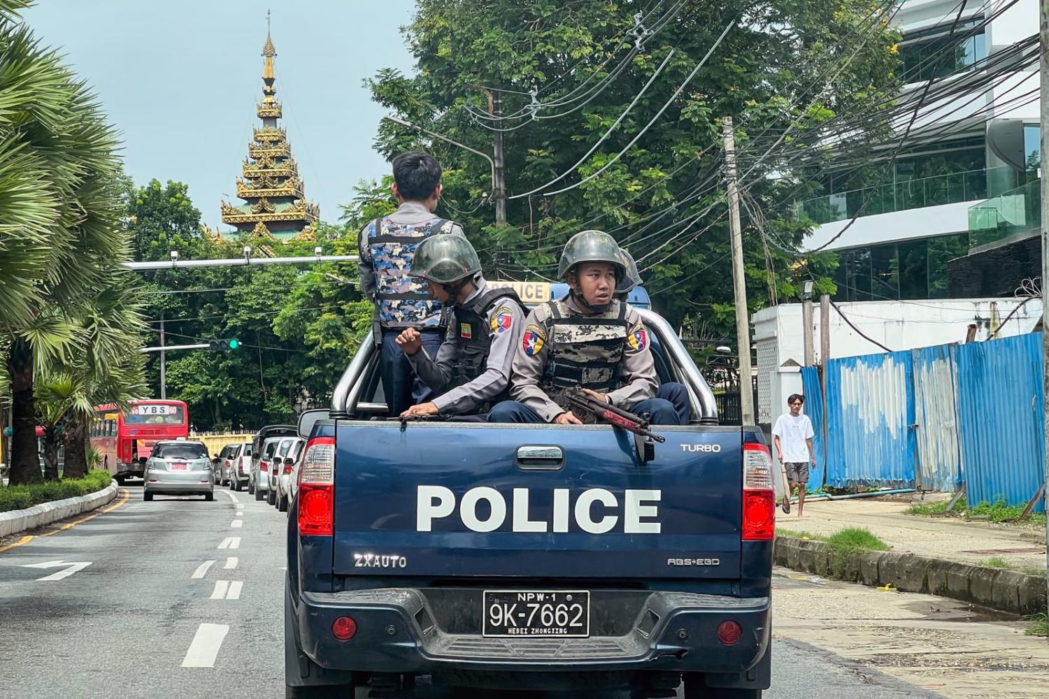 Police patrol on a street in Yangon last month (STR/AFP via Getty Images)