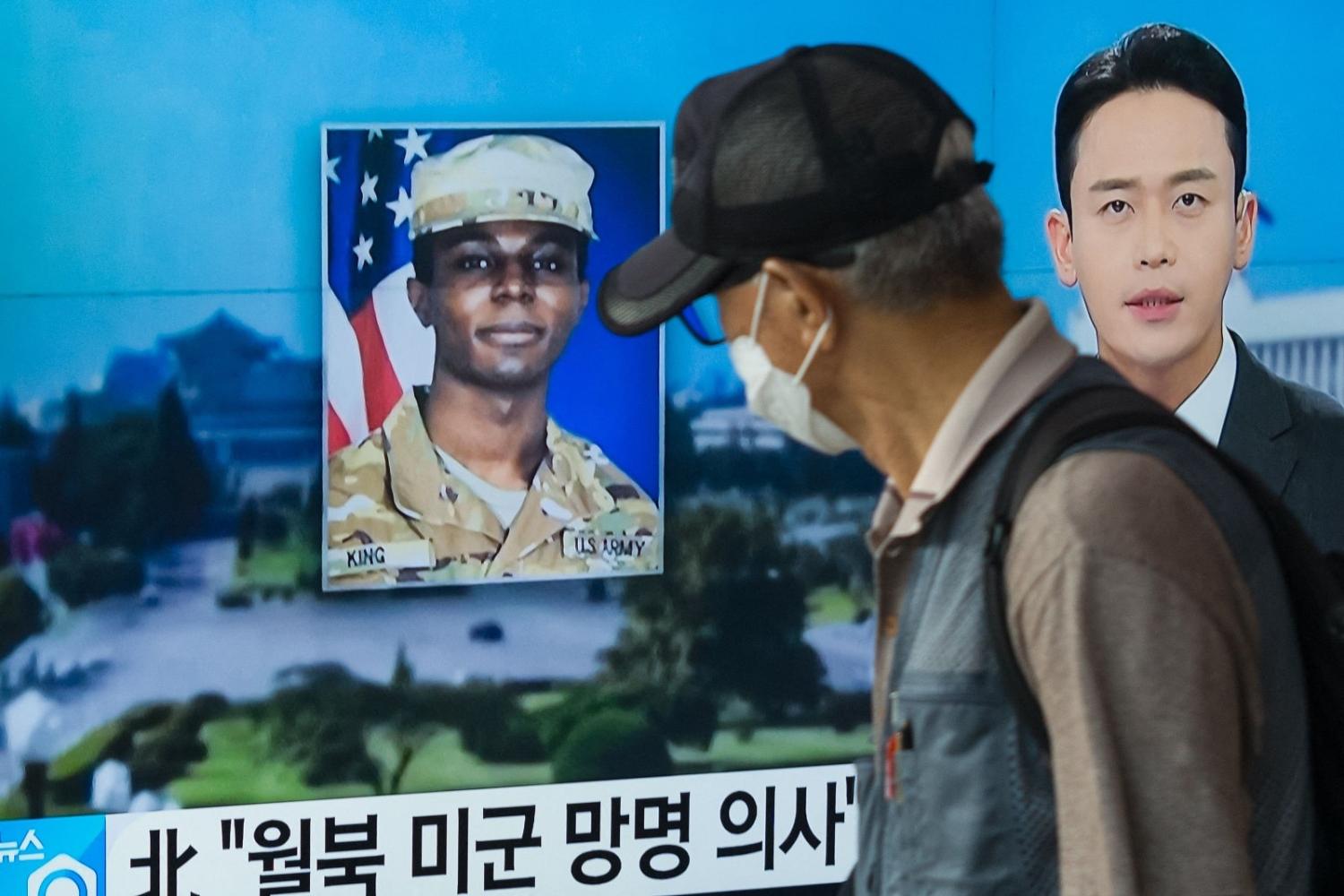 A news broadcast in Seoul on 16 August features US soldier Travis King, who ran across the border into North Korea while part of a DMZ tour group (Anthony Wallace/Getty Images)