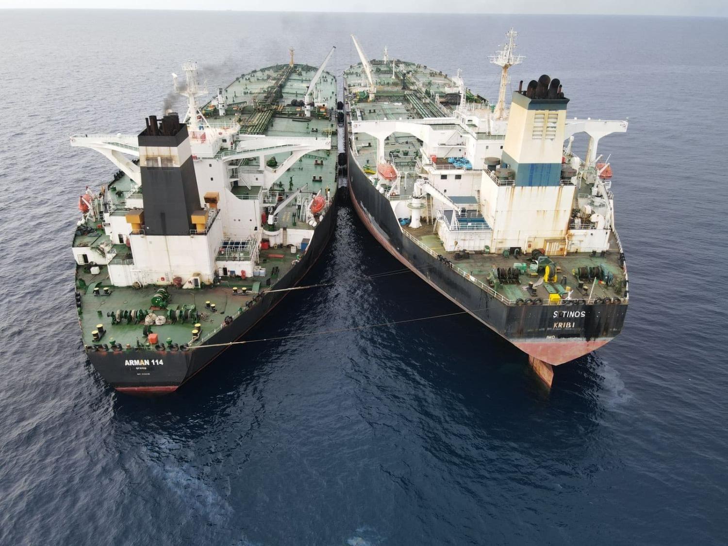 Iranian-flagged Arman 114 and Cameroon-flagged S Tinos carry out an allegedly illegal ship-to-ship transfer in Indonesia's North Natuna Sea on 11 July 2023 (Indonesian Maritime Security Agency/Anadolu Agency via Getty Image)