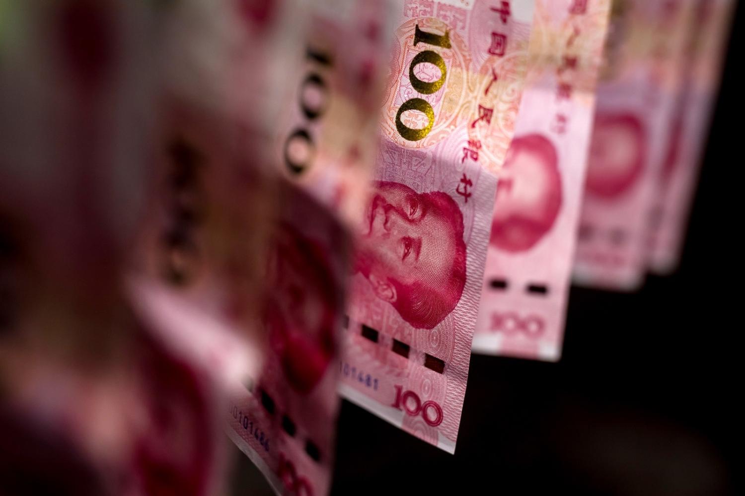 China’s government may deliberately weaken its currency in an attempt to export the economy out of trouble (Paul Yeung/Bloomberg via Getty Images)