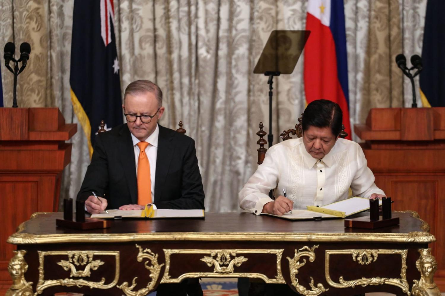 Australia's Prime Minister Anthony Albanese, left, and Philippines' President Ferdinand Marcos Jr. sign a Memorandum of Understanding at the Malacanang Palace in Manila in September this year (Earvin Perias via AFP/Getty Images) 