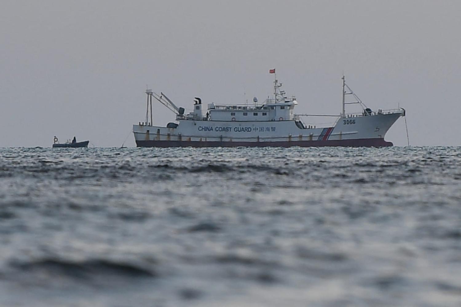 A Chinese coast guard ship anchored near Scarborough Shoal in September (Ted Aljibe/AFP via Getty Images)