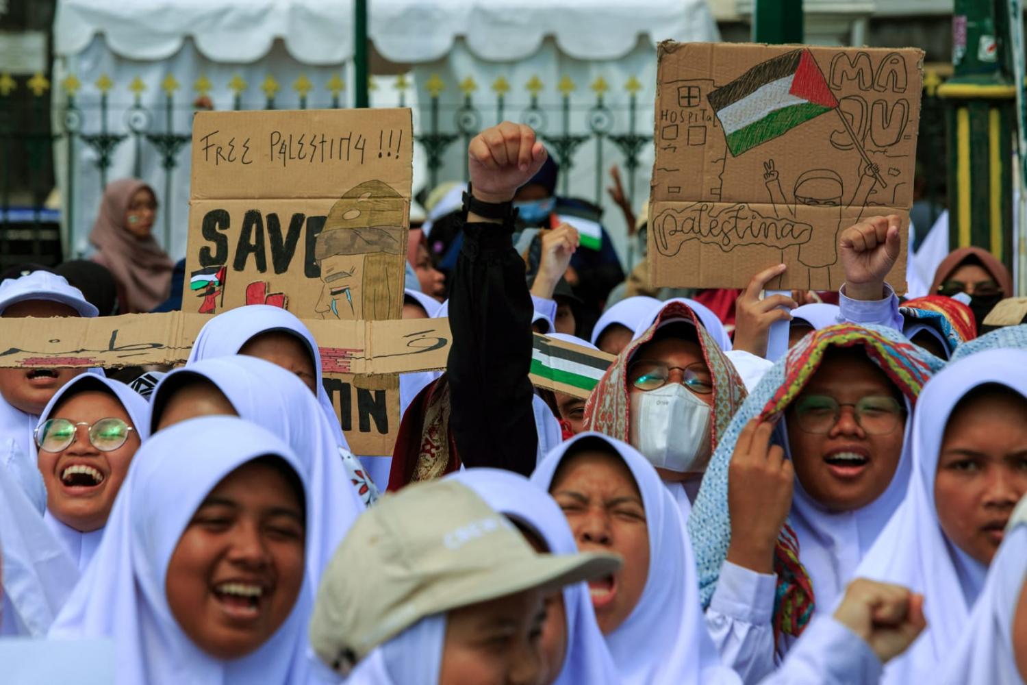 Demonstrators during a pro-Palestinian rally in Yogyakarta, Indonesia, on 13 October (Devi Rahman/AFP via Getty Images)