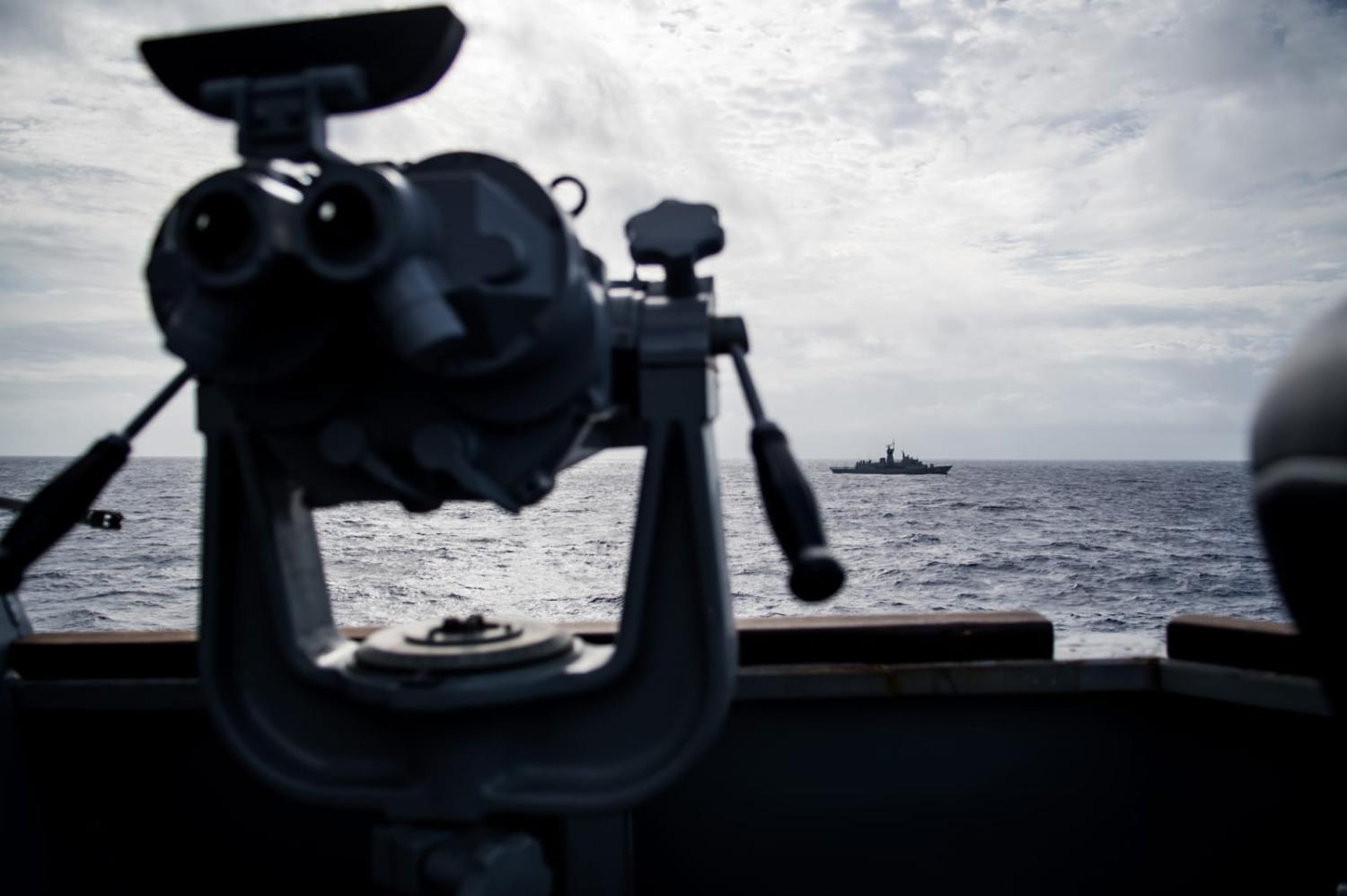 Divers from HMAS Toowoomba, seen here in the distance during 2018 exercises with the US Navy, reportedly received minor injuries last week from a sonar pulse fired by China (Devin M. Langer/US Navy)