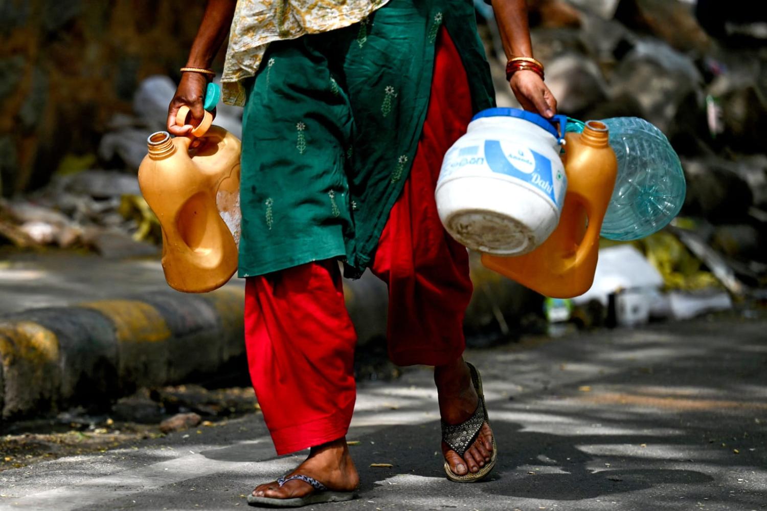 Women and girls are often largely responsible for daily water collection, which can become even more of a burden in times of drought (Money Sharma/AFP via Getty Images)