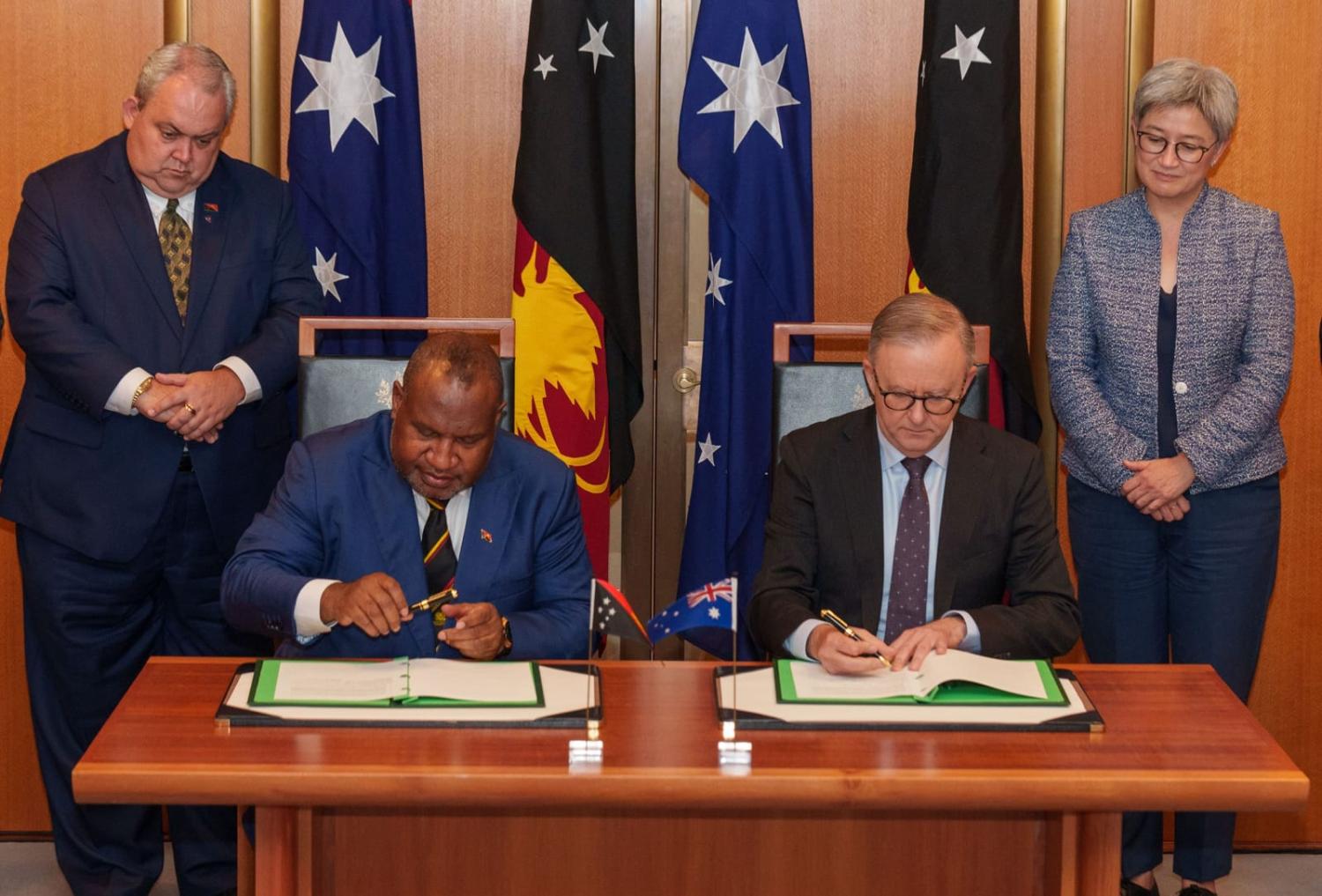 Signing the Australia-PNG bilateral security agreement in Canberra, 7 December (@AlboMP/X)
