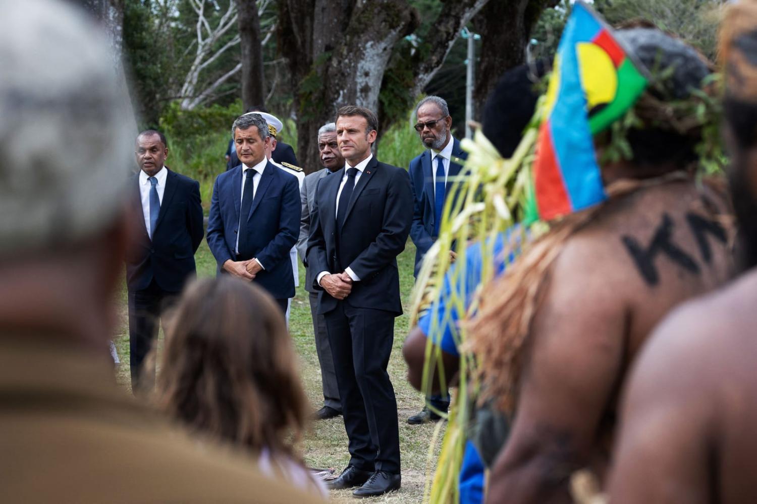 French President Emmanuel Macron, centre, during a visit to New Caledonia in July (Raphael Lafargue via AFP/Getty Images)