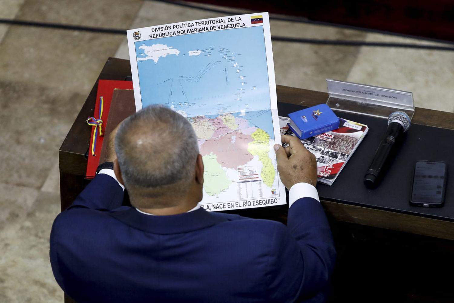 Debate in Venezuela's National Assembly on Wednesday featuring new map showing the accession of Guyana Essequiba (Pedro Rances Mattey/AFP via Getty Images)