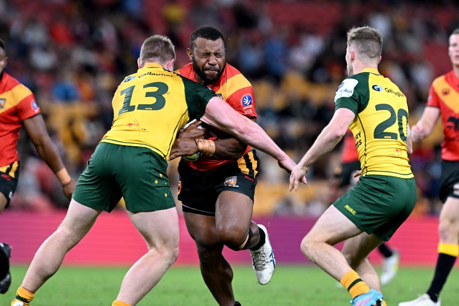 McKenzie Yei of Papua New Guinea takes on the defence during the international match between Australian Men's PMs XIII and PNG Men's PMs XIII at Suncorp Stadium, Brisbane, 25 September 2022 (Bradley Kanaris/Getty Images)