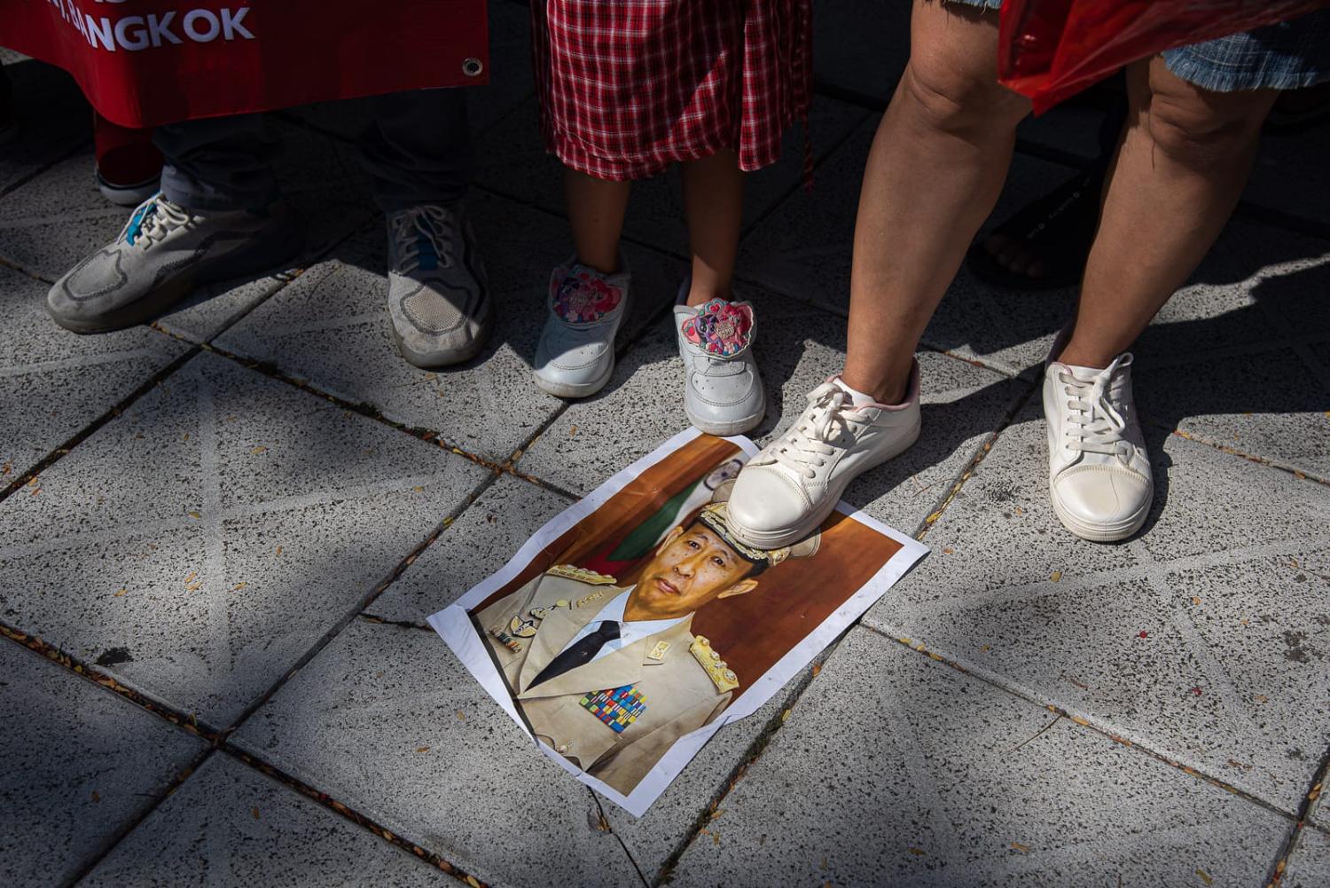 Protesters step on a portrait of General Soe Win, Burmese army general and current Deputy Prime Minister of Myanmar, during the demonstration last month in front of the United Nations building in Bangkok (Peerapon Boonyakiat via Getty Images)
