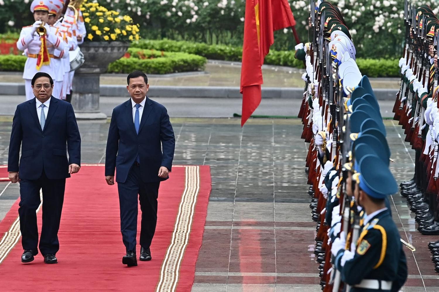 Vietnam’s Prime Minister Pham Minh Chinh, left, with his counterpart from Cambodia Prime Minister Hun Manet at the Presidential Palace in Hanoi, 11 December 2023 (Nhac Nguyen/AFP via Getty Images)