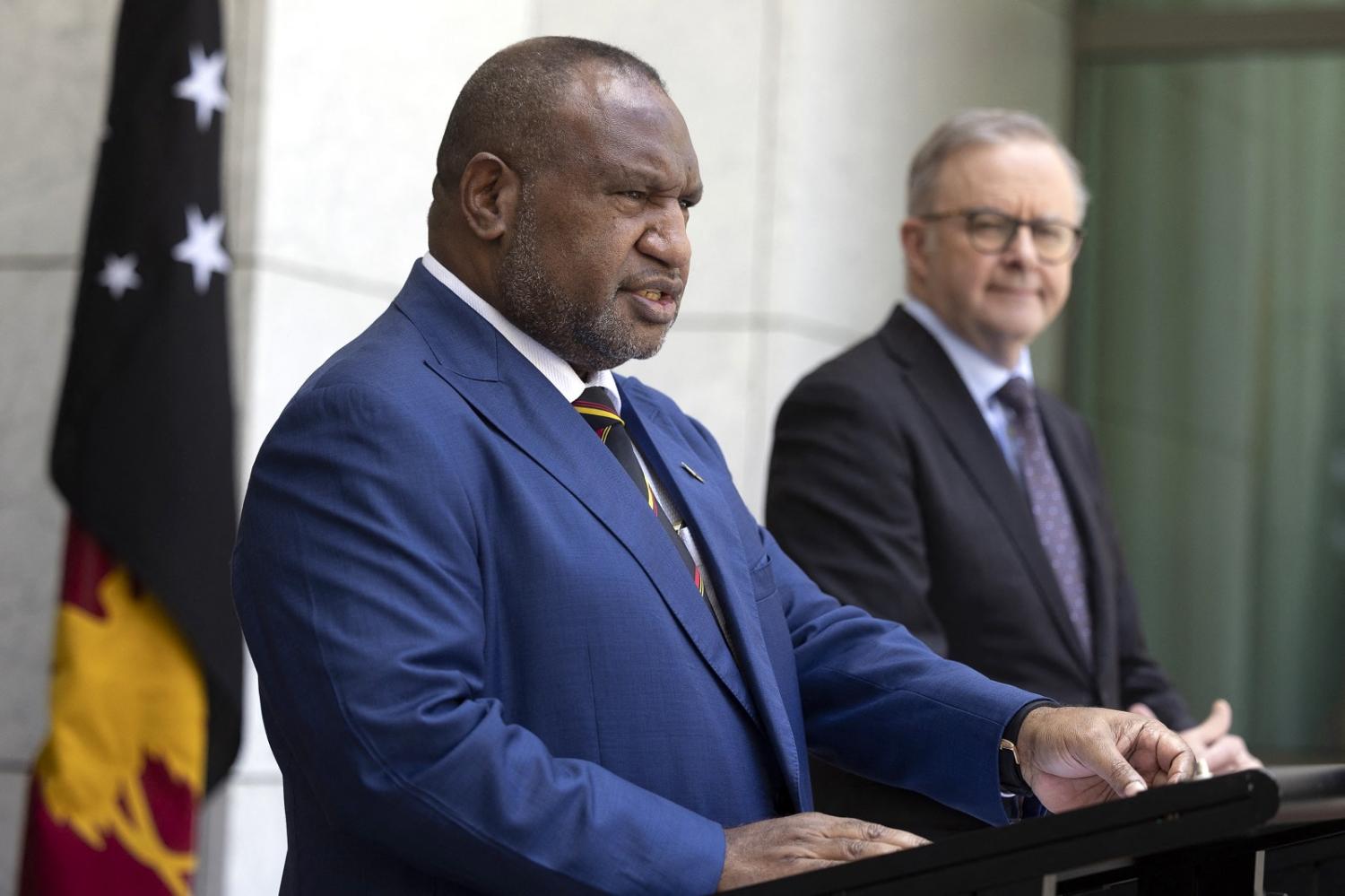 PNG's Prime Minister James Marape speaks as Australia's PM Anthony Albanese (R) looks on during a press conference at Parliament House in Canberra on 7 December 2023 (Hilary Wardhaugh/AFP via Getty Images)
