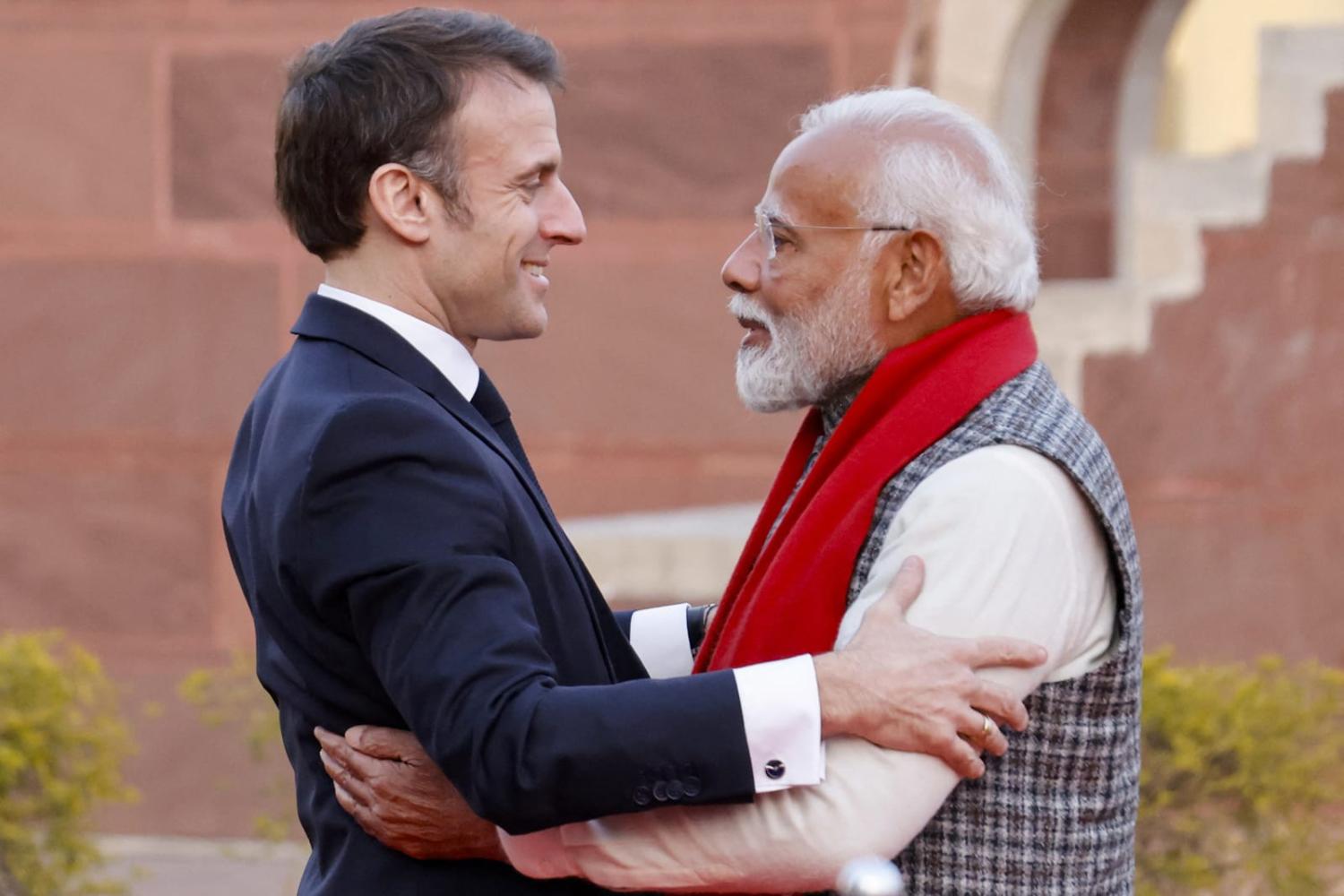 India's Prime Minister Narendra Modi, right, and France's President Emmanuel Macron embrace during a visit at the Janta Mantar observatory in Jaipur in January (Ludovic Marin/AFP via Getty Images)