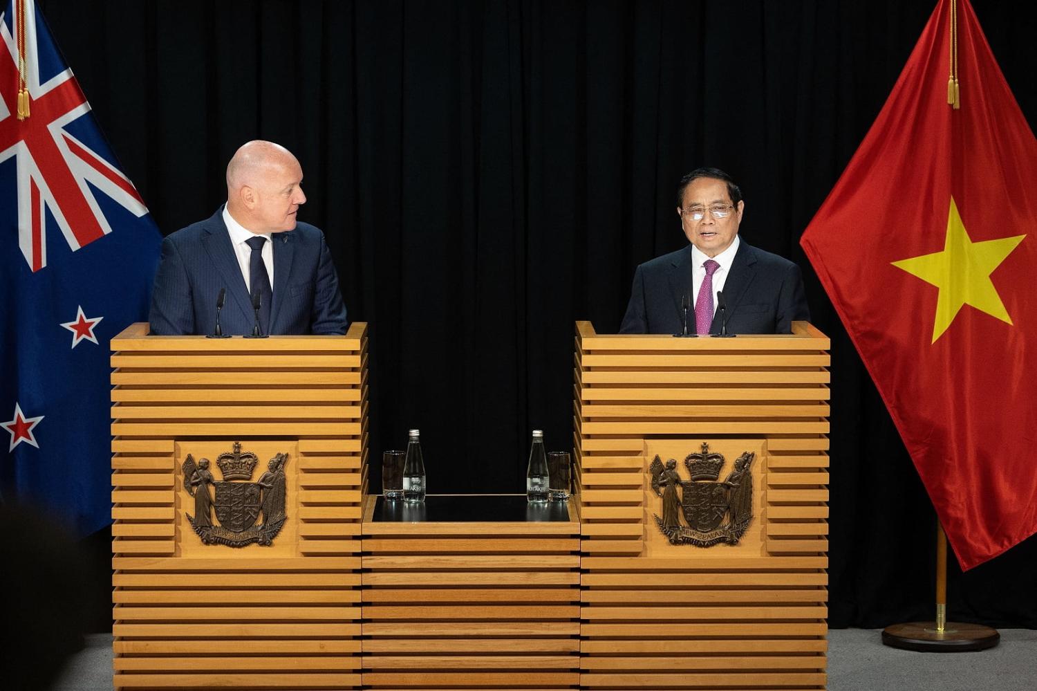 New Zealand's Prime Minister Christopher Luxon (L) and Vietnam's Prime Minister Pham Minh Chinh attend a trade signing ceremony on 11 March 2024 in Wellington (Marty Melville/AFP via Getty Images)