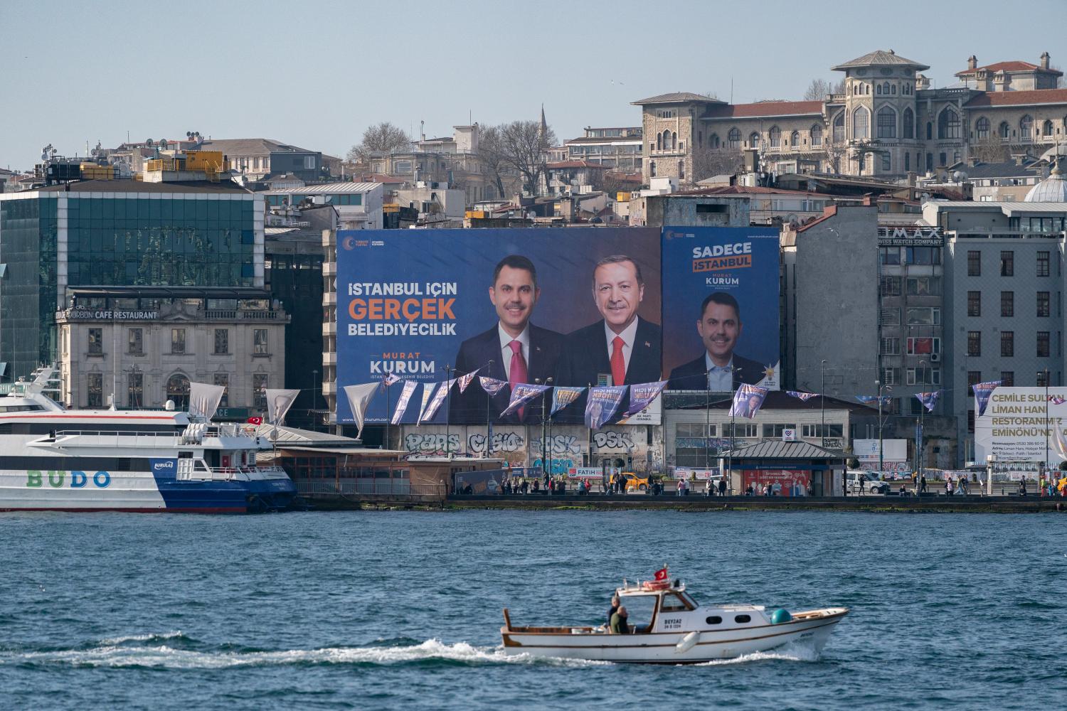A large billboard of Türkiye's President Recep Tayyip Erdoğan and Murat Kurum, the AK Party's candidate ahead of municipal elections in Türkiye on 29 March (Getty/David Lombeida)