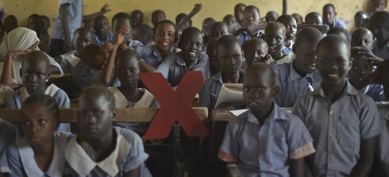 Refugees from Kakuma pose with the TedX logo (Photo: TEDxKakumacamp/Flickr)