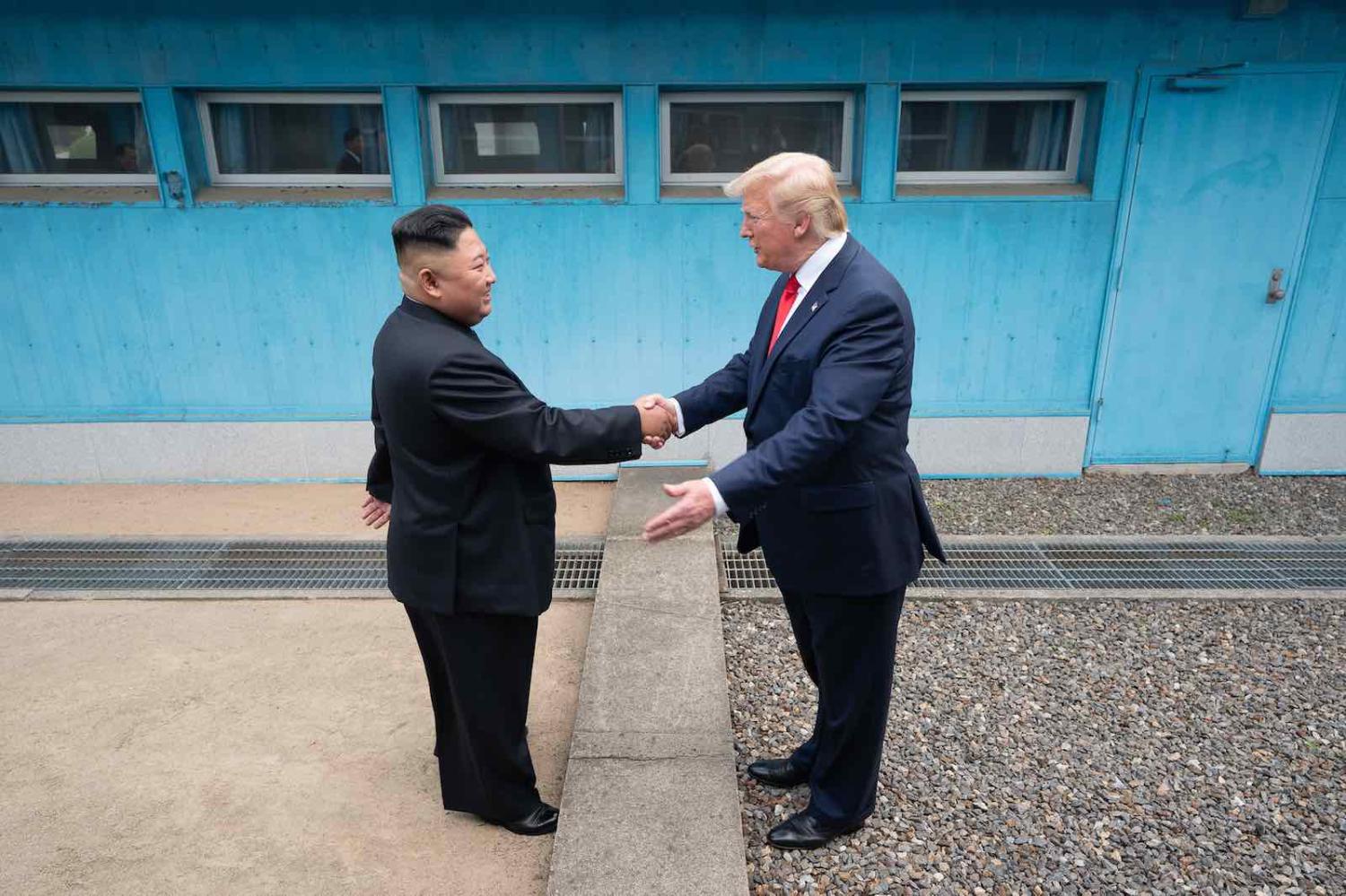 North Korean leader Kim Jong-un shakes hands with US President Donald Trump at the Demilitarized Zone between North and South Korea, 30 June 2019 (Photo: Shealah Craighead/The White House/Flickr)