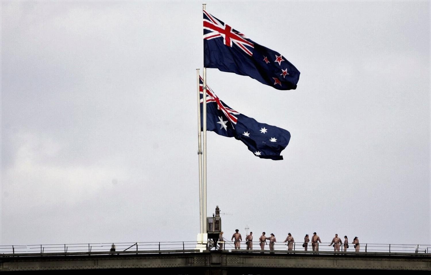 The New Zealand and Australian flags fly on the Sydney Harbour Bridge to commemorate Anzac Day (Photo: Ian Waldie/Getty)