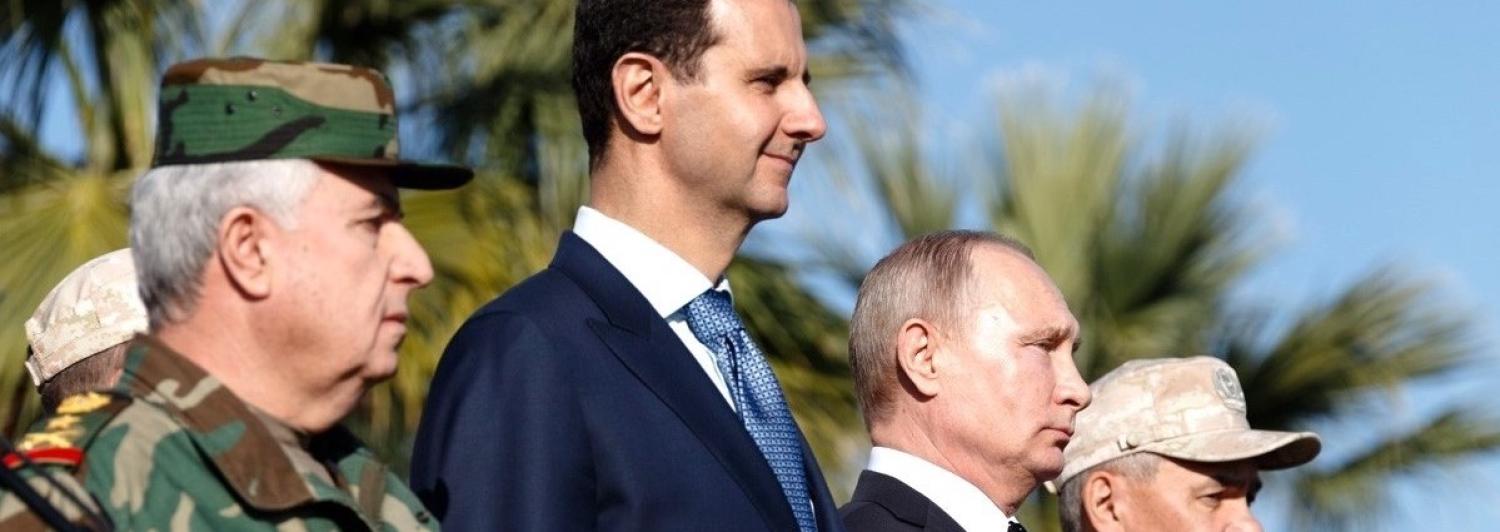 Russian President Vladimir Putin and Syrian President Bashar al-Assad visit Hmeymim base, Syria, in 2017 (Photo: Kremlin Press Office/Getty)