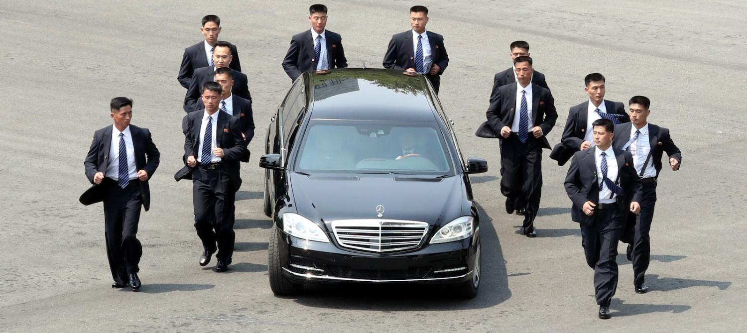 North Korean Leader Kim Jong-un escorted by his jogging bodyguards (Photo: Getty Images)