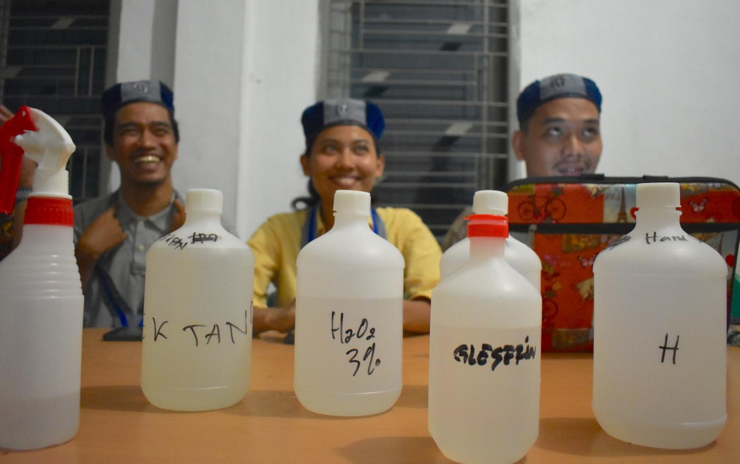 students from GMKI, or the Indonesian Students’ Christian Movement, making hand sanitiser (Supplied photos) 