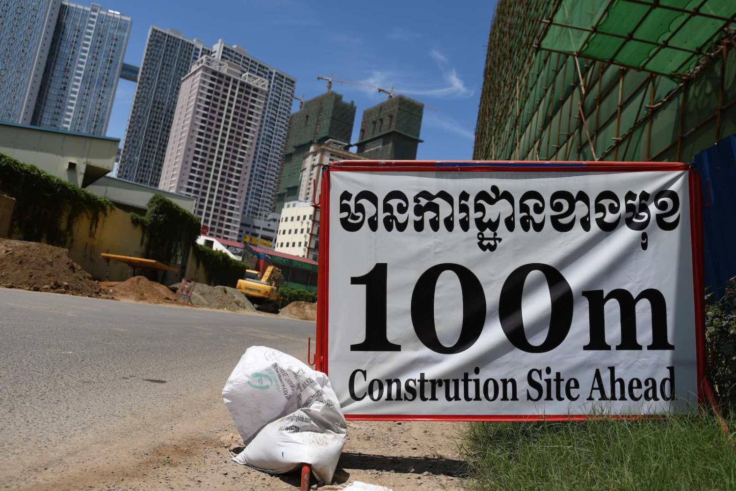 Occasional road-signs to warn passers-by does not do justice to the intensity of construction seen in the Cambodian capital (Photos by Simon Roughneen)