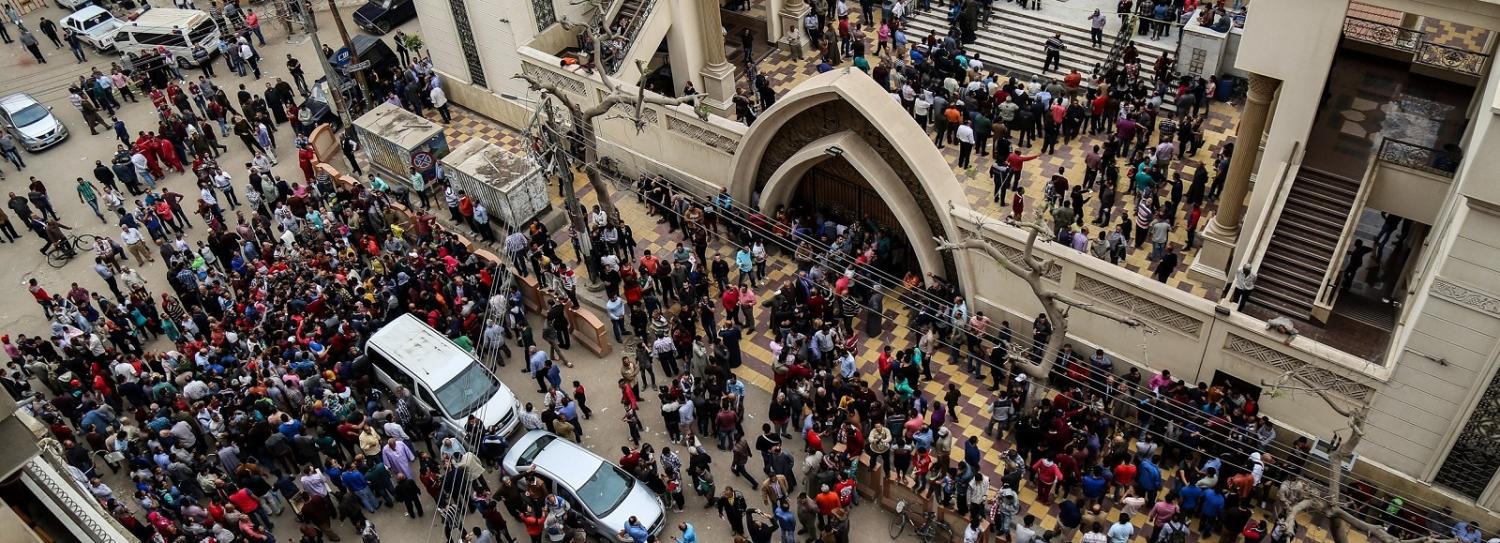 People gather in front of the Saint George church in Tanta after a bomb struck inside on 9 April (Photo: Ibrahim Ramadan/Getty Images)