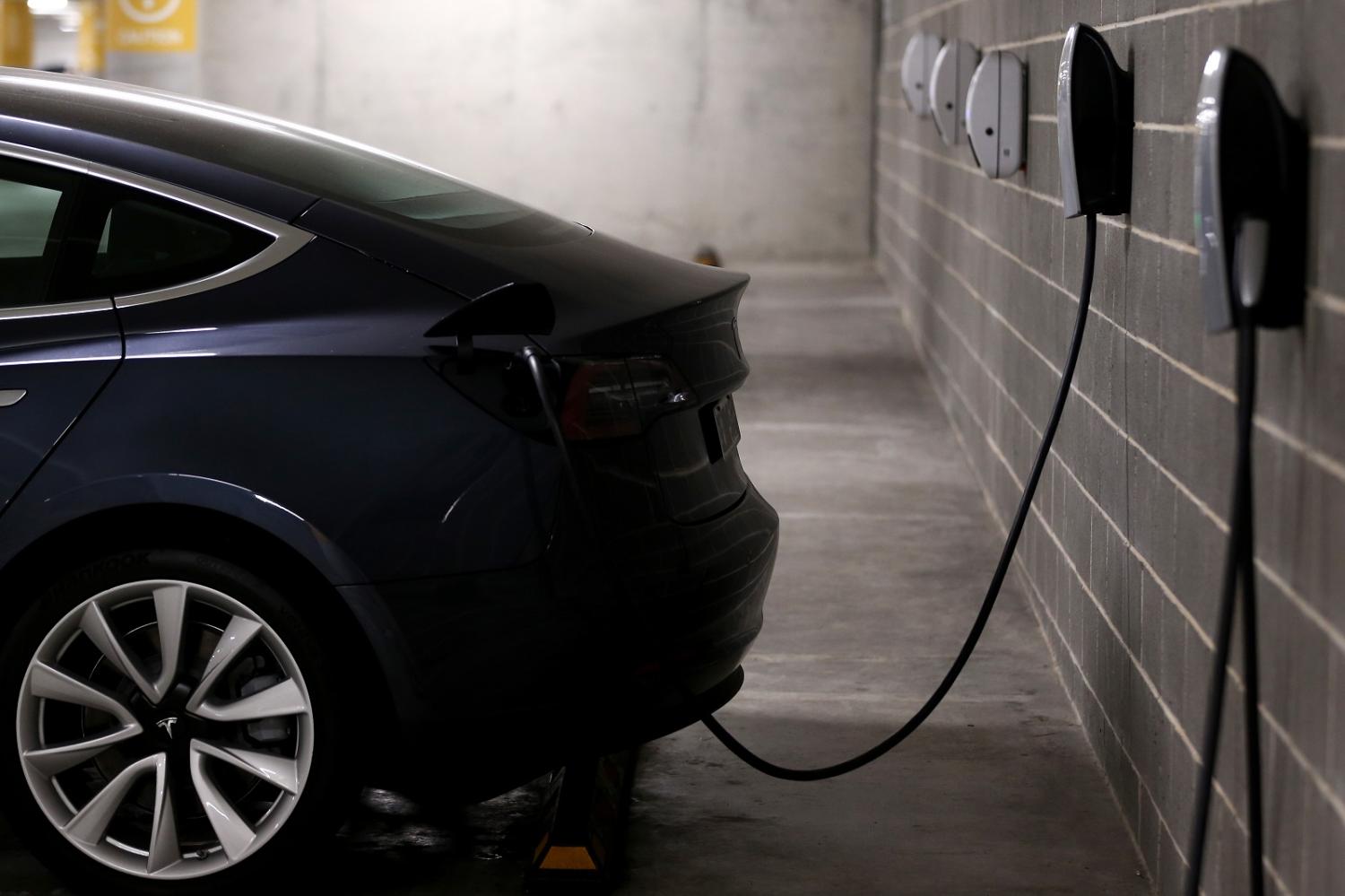 A Tesla at an EV charge station in Lane Cove, Sydney (Brendon Thorne/Getty Images)