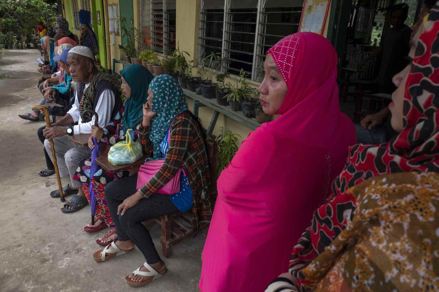 Residents wait to vote on an autonomy referendum, 6 February 2019, Salvador, Lanao del Norte, southern Philippines (Jes Aznar/Getty Images) 