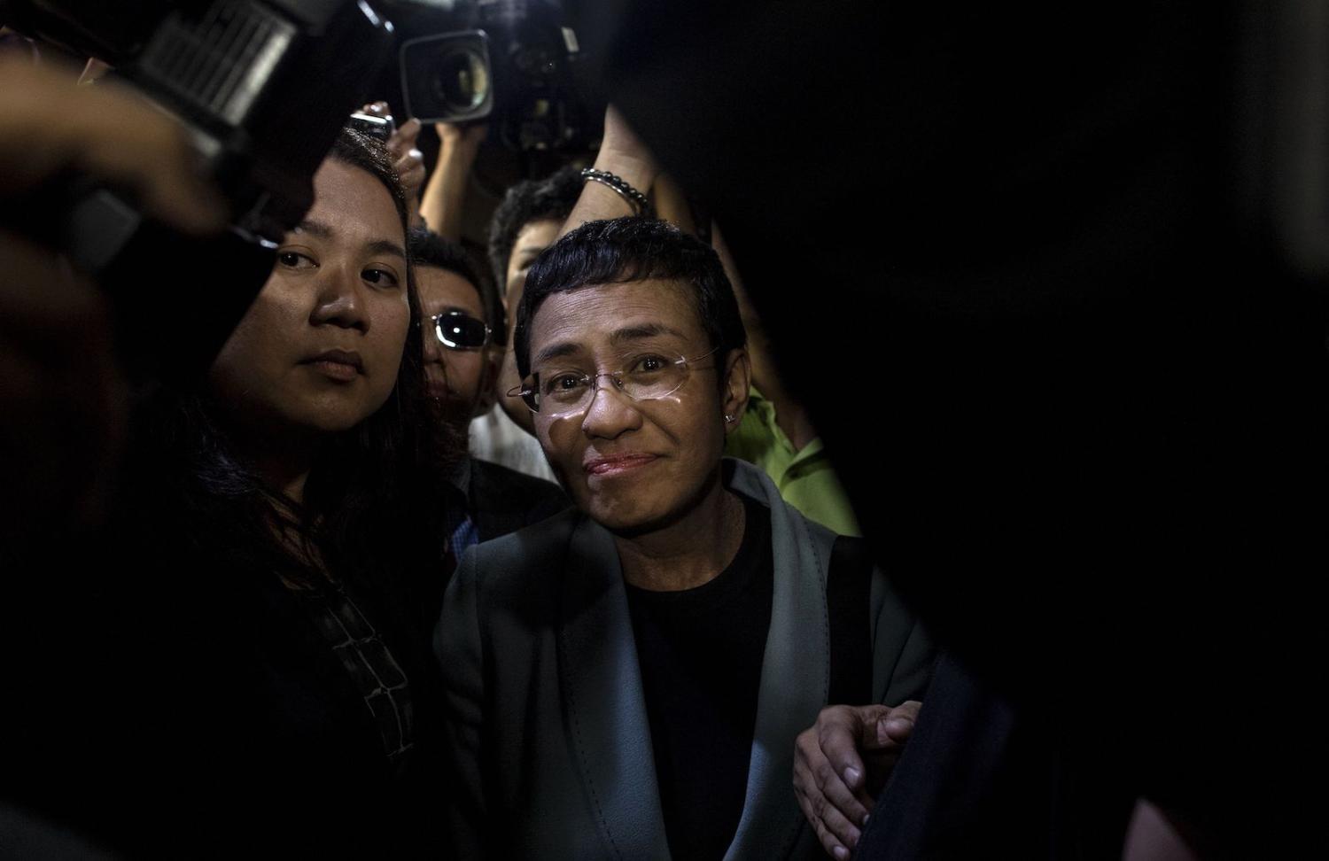 Philippine journalist Maria Ressa (centre) arrives at a regional trial court in Manila to post bail in February 2019 (Noel Celis/AFP via Getty Images)