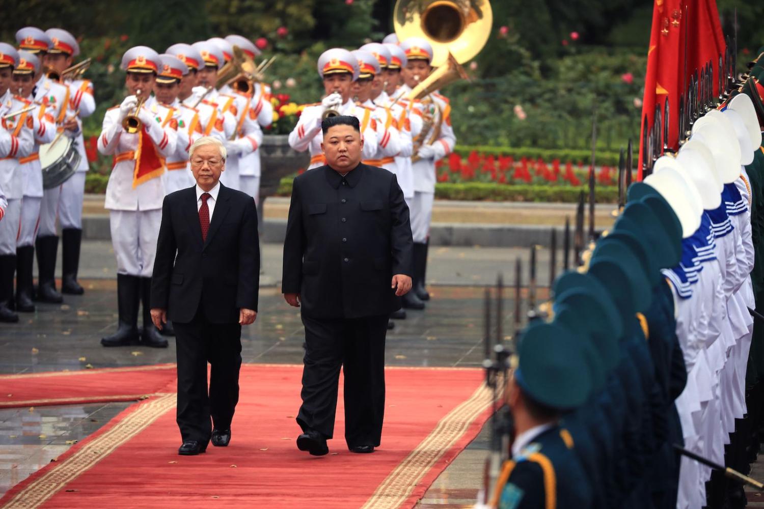 North Korean leader Kim Jong-un (right) attends a welcome ceremony with Vietnamese President Nguyen Phu Trong, 1 March 2019 in Hanoi (The Asahi Shimbun via Getty Images)