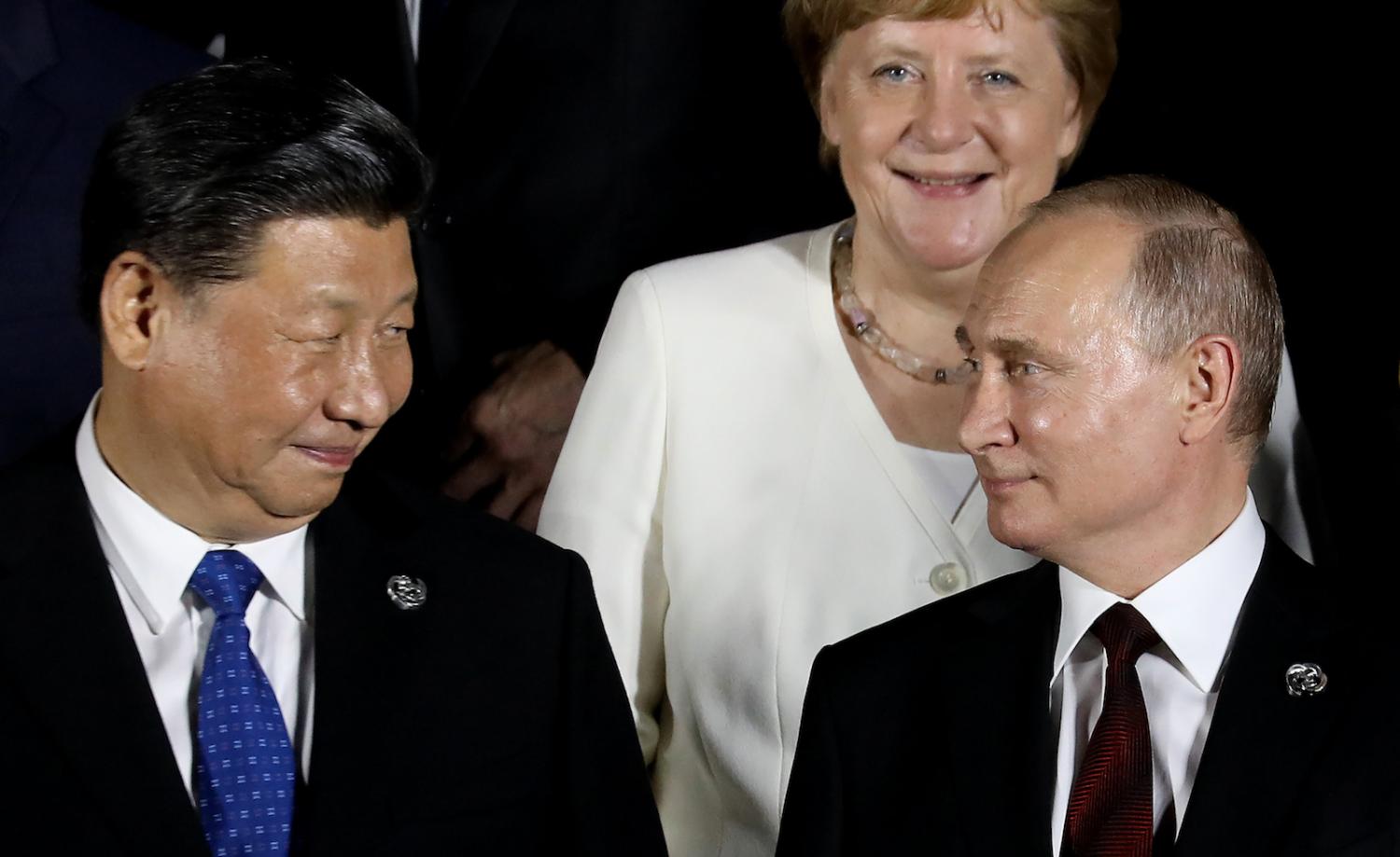 Chinese President Xi Jinping (L) and Russian President Vladimir Putin (R) at the G20 Summit in Osaka, Japan, June 2019 (Photo: Dominique Jacovides/AFP/Getty)