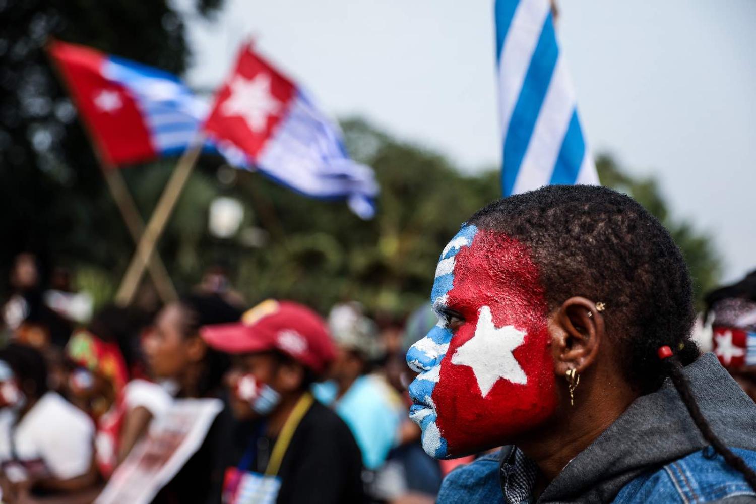 A woman with her face painted with the flag of West Papua, at a rally in Jakarta, Indonesia, 28 August 2019 (Andrew Gal/NurPhoto via Getty Images)