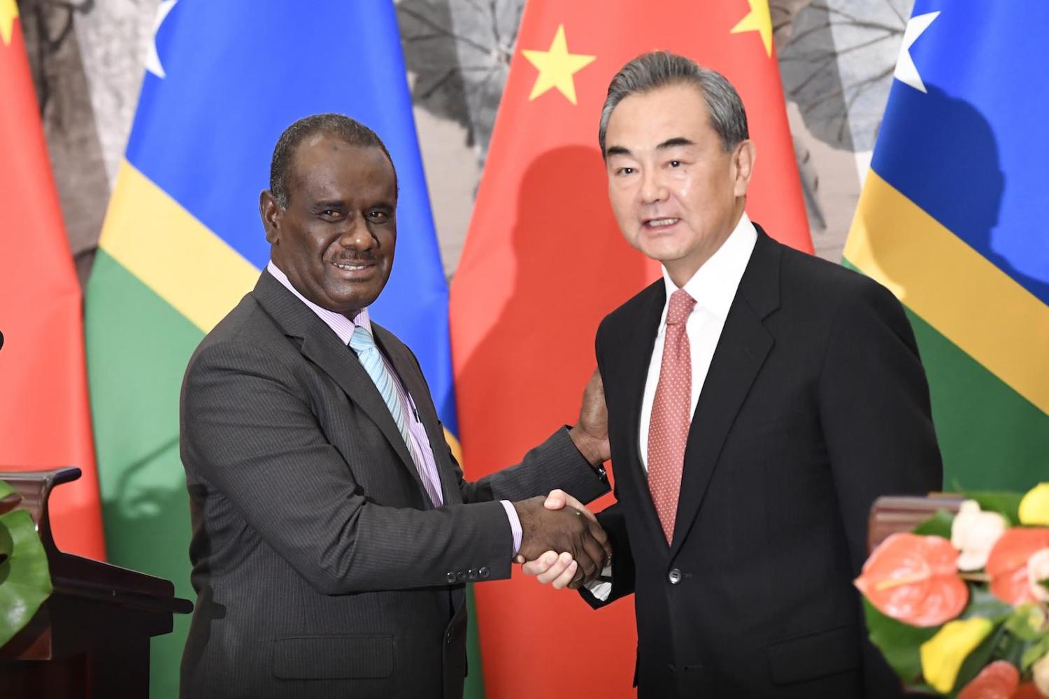 New friends: Solomon Islands Foreign Minister Jeremiah Manele (L) and Chinese Foreign Minister Wang Yi, on 21 September 2019 in Beijing (Photo: Naohiko Hatta via Getty)