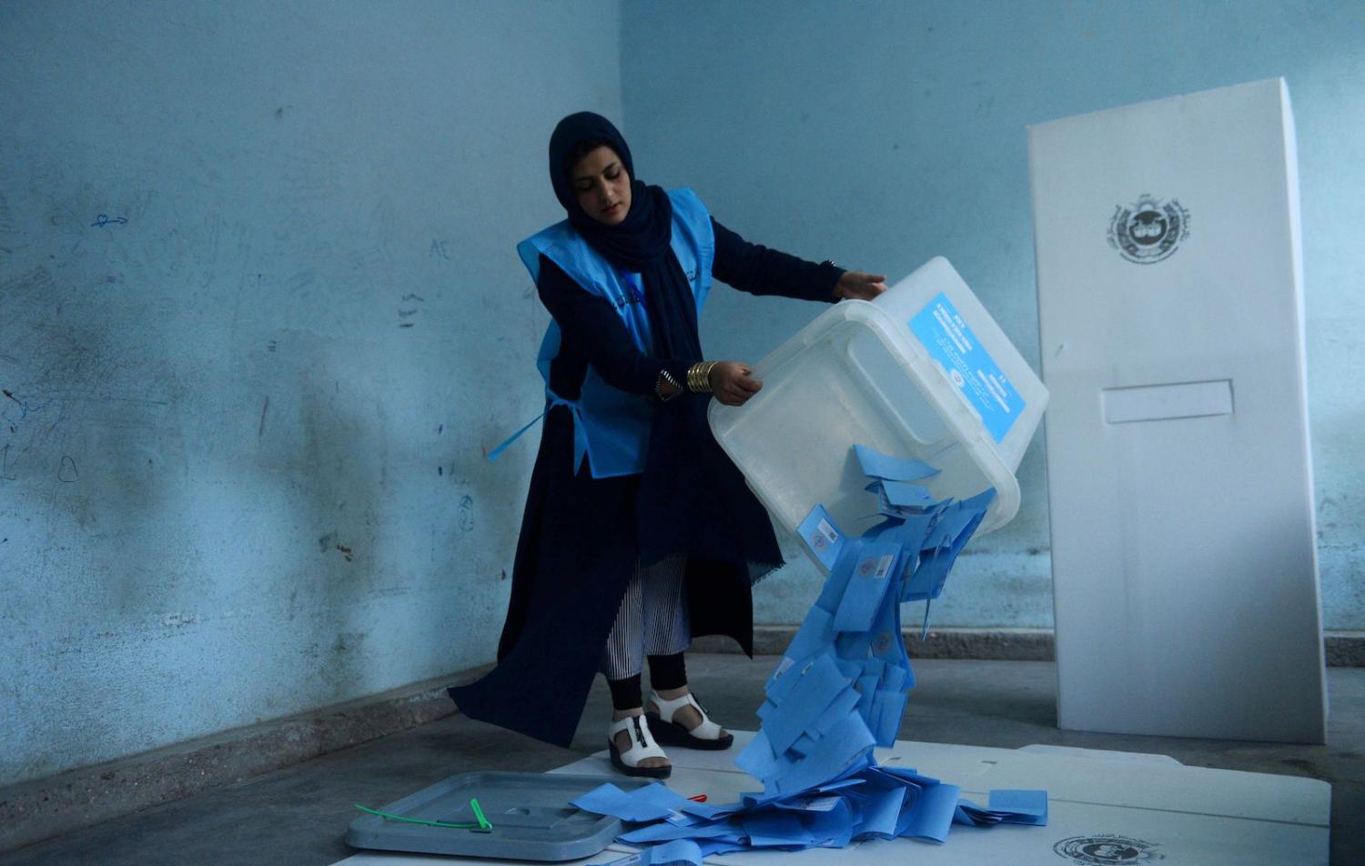 An Afghan election official empties a ballot box to count ballot papers, Herat, 28 September 2019 (Photo: Hoshang Hashimi/AFP/Getty Images)