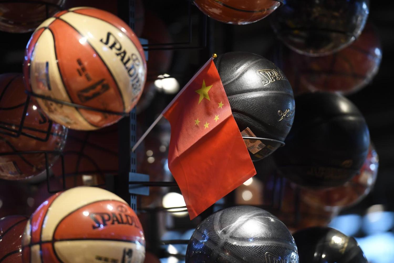 A Chinese flag is placed into a display of basketballs in the National Basketball Association (NBA) store in Beijing this month (Photo: Greg Baker/AFP/Getty Images)