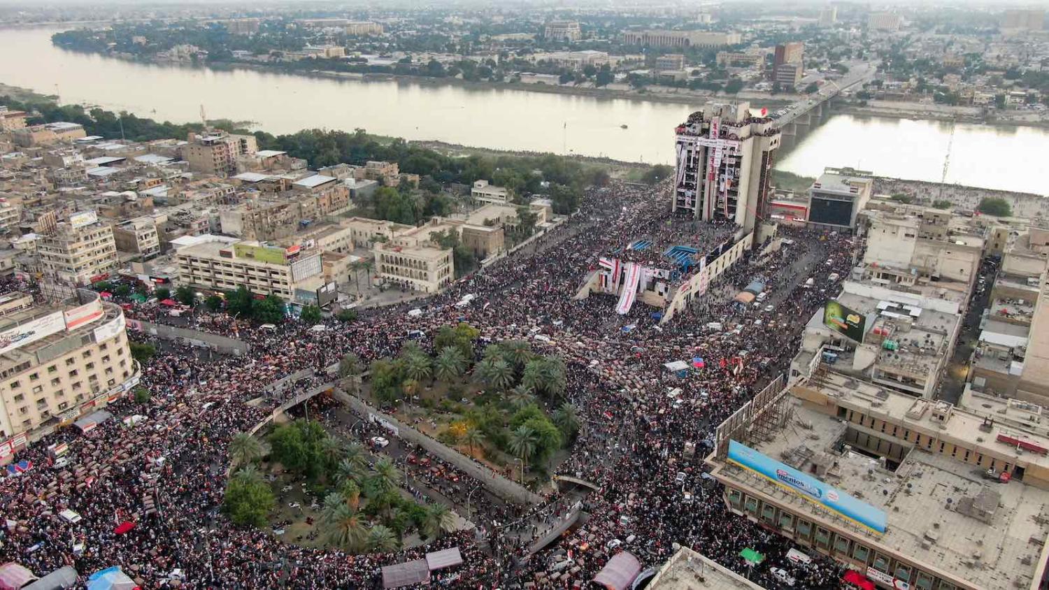 Iraqi protesters gathering last month at Baghdad's Tahrir square (Photo: AFP via Getty Images)