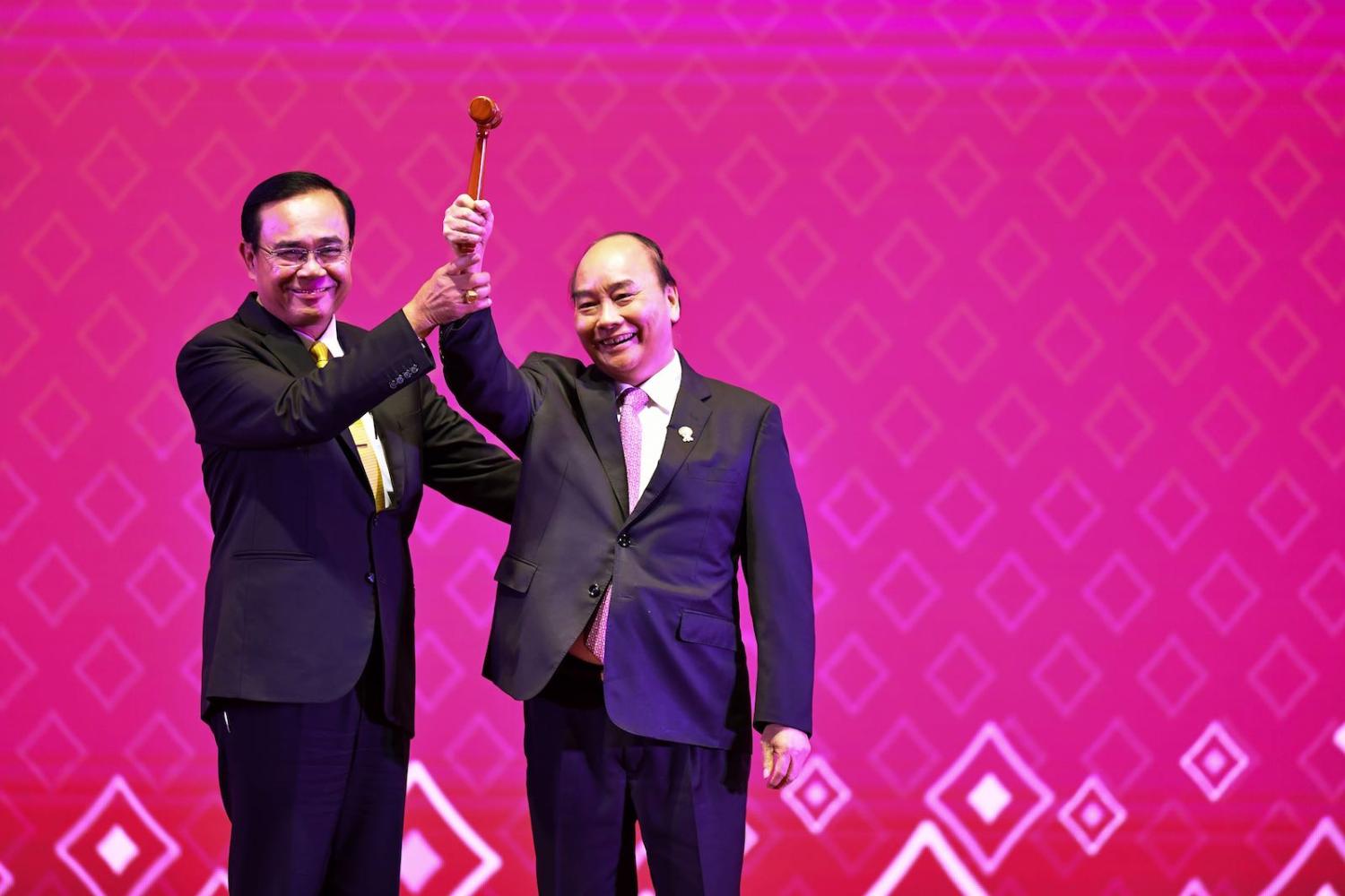 Vietnam’s Prime Minister Nguyen Xuan Phuc raises the gavel as ASEAN chair for 2020 after a handover from Thailand’s Prayut Chan-O-Cha (Photo: Lillian Suwanrumpha/AFP/Getty Images)  