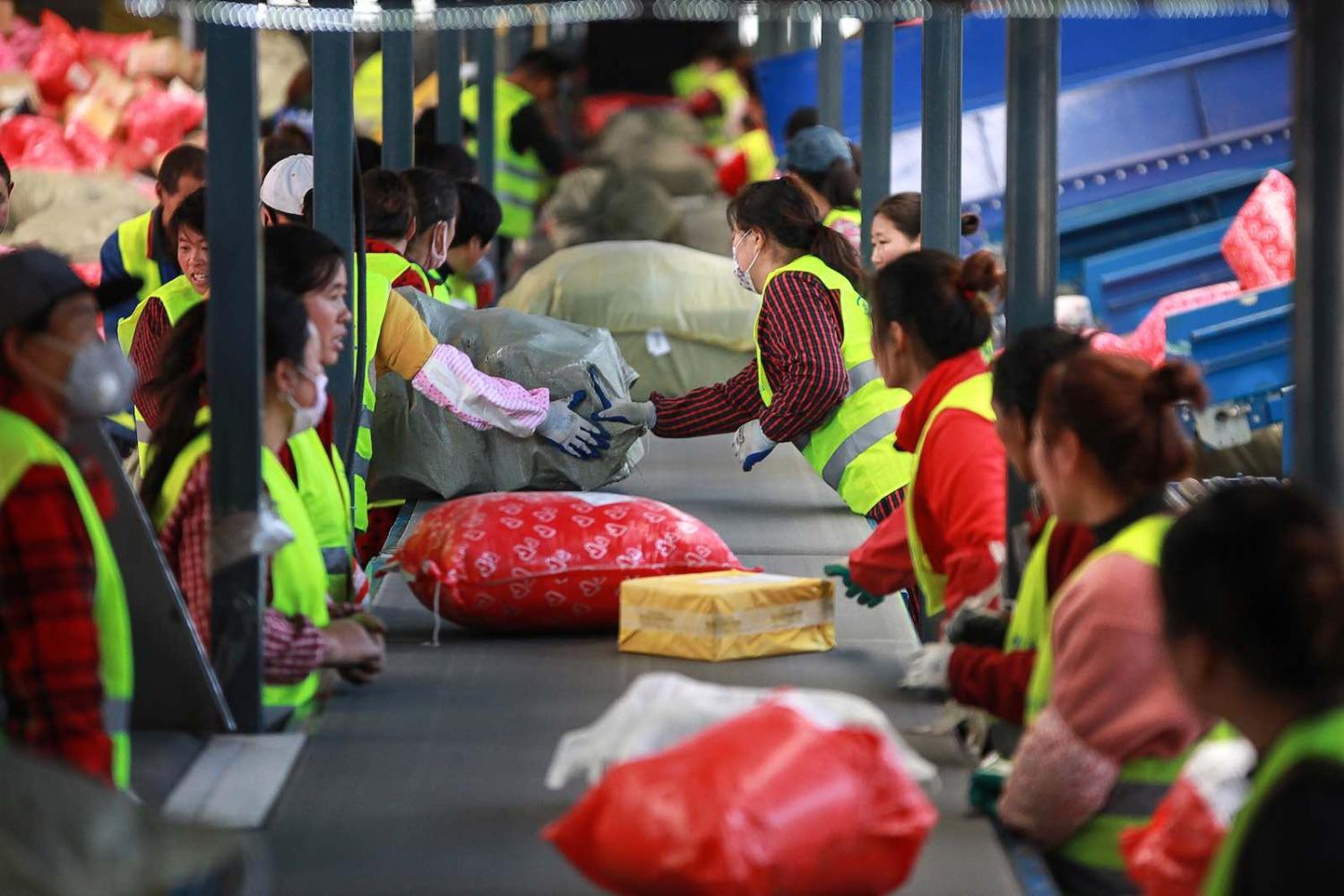 Sorting out packages at a delivery warehouse on “Singles’ Day” – the world’s biggest 24-hour shopping event – in Yangzhou, China (Photo: STR/AFP/Getty Images)